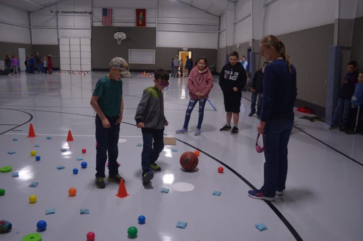 Image of kids doing an activity in a gym