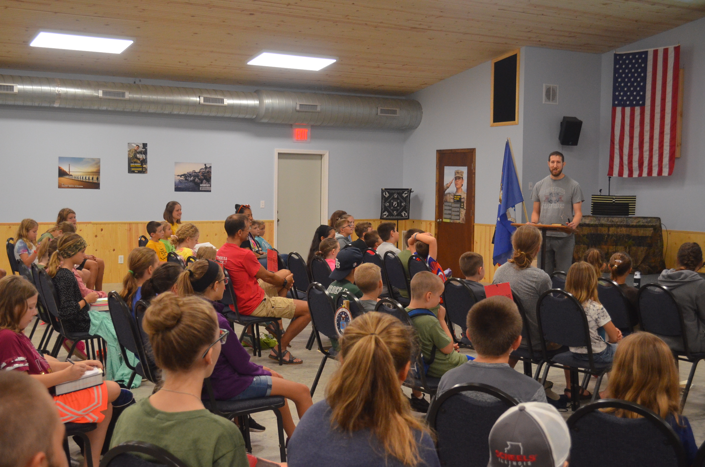 Image of camp missionary speaking to the campers