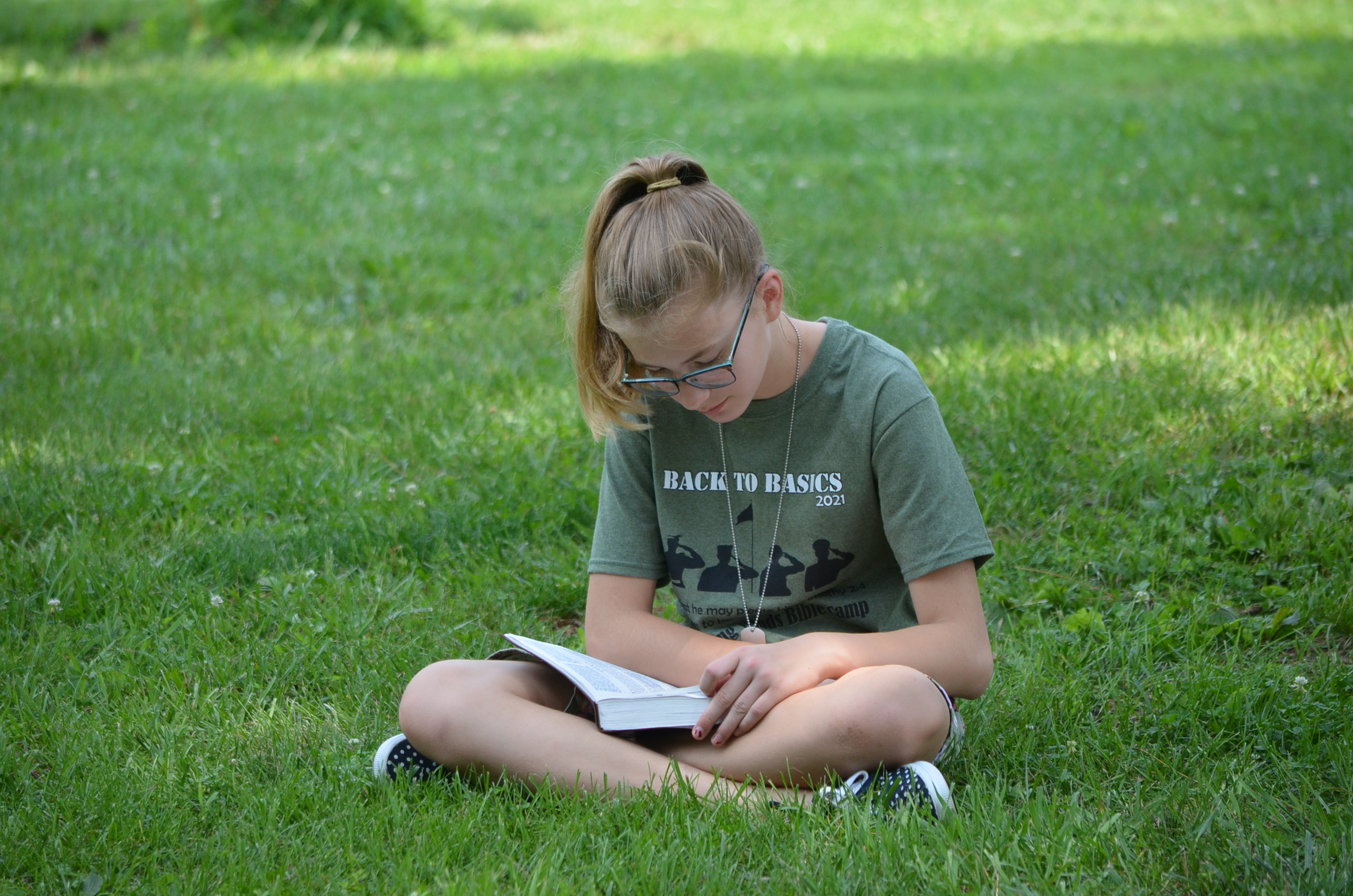 Image of a girl memorizing Bible verses